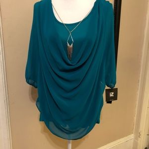 Draped front green blouse with necklace